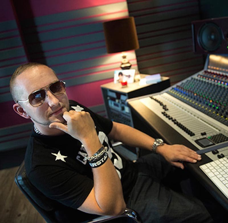 Ben Mühlethaler seated at the mixing console in the B-Note control room
